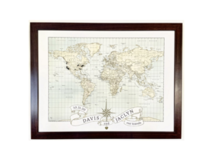 Personalized world travel pushpin map for a unique wedding registry idea.
