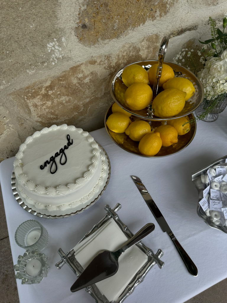 Classy engagement party decor on a budget with cake and lemons.