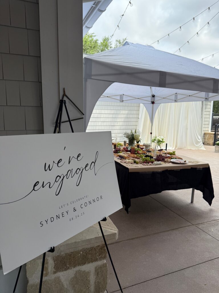 "We're engaged" sign at an engagement party.