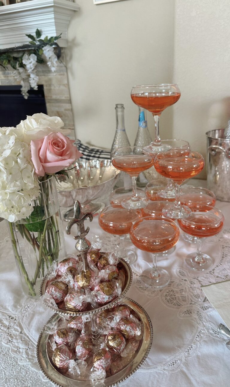 Pink floral bridal shower theme with champagne tower.