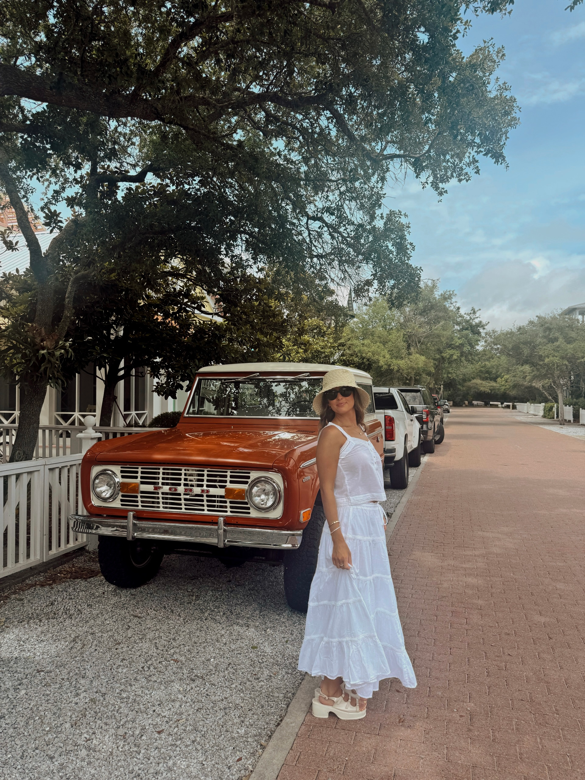 Bride posing next to a vintage Ford truck in Seaside, Florida on her bachelorette party.