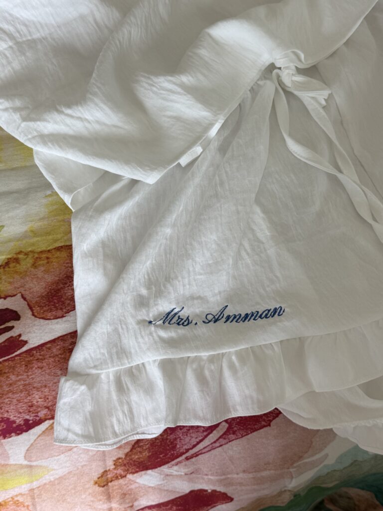 White bridal pajamas with new last name embroidered on the shorts.