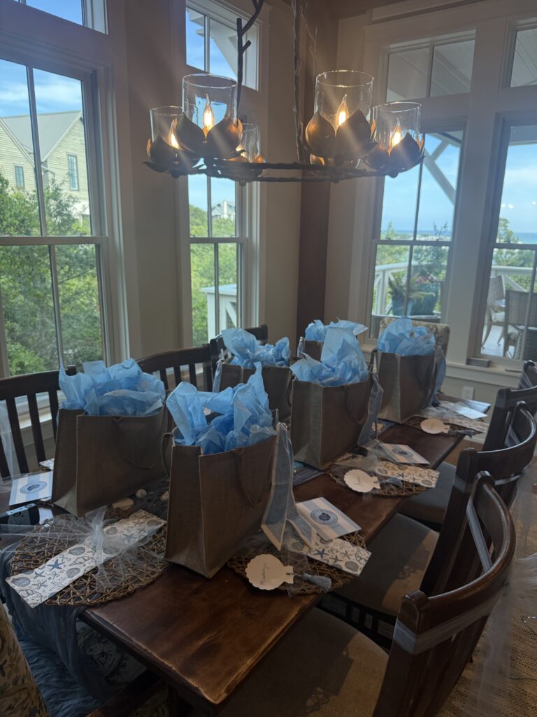 Bachelorette welcome bags set up on a table.