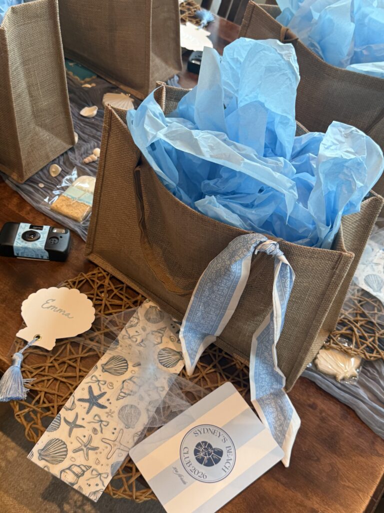 Up close picture of a bachelorette welcome bag with a blue, beachy, theme.
